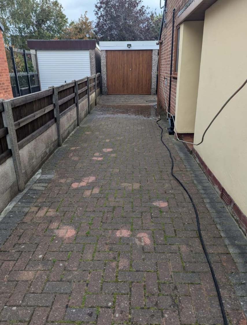 Dirty driveway before being jet washed